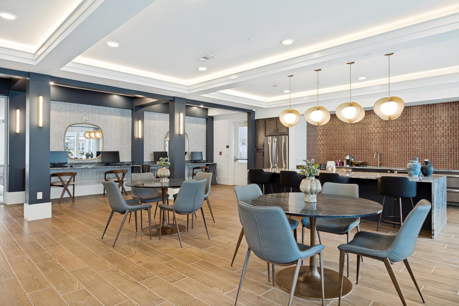 Cafe and co-working lounge with round tables and individual workspaces, Allegra at Shreveport