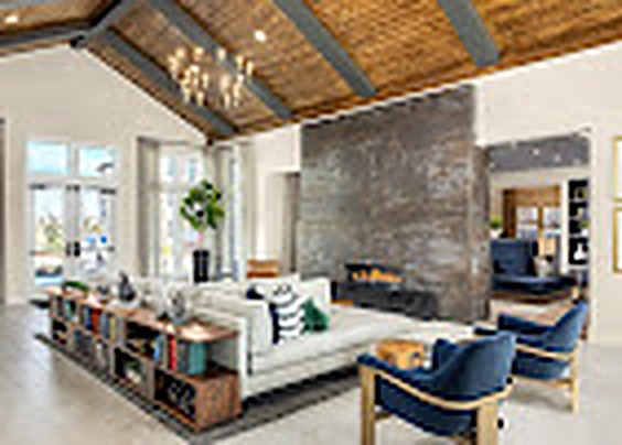 Great room with a fireplace and seating beneath a wood ceiling, Alexan Lake Olympia