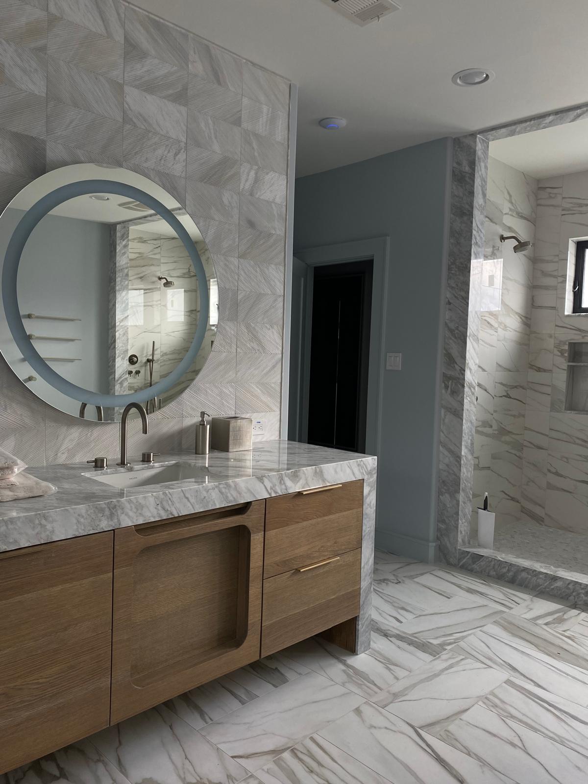 White oak primary bath vanity with a round illuminated mirror, Montrose